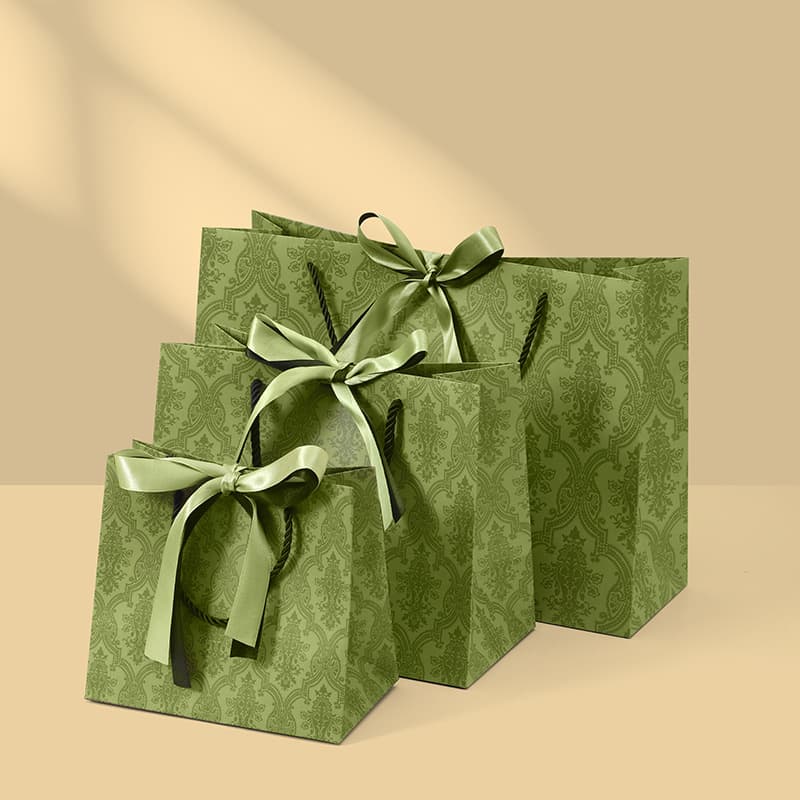 Coordinated paper gift bags in multiple sizes